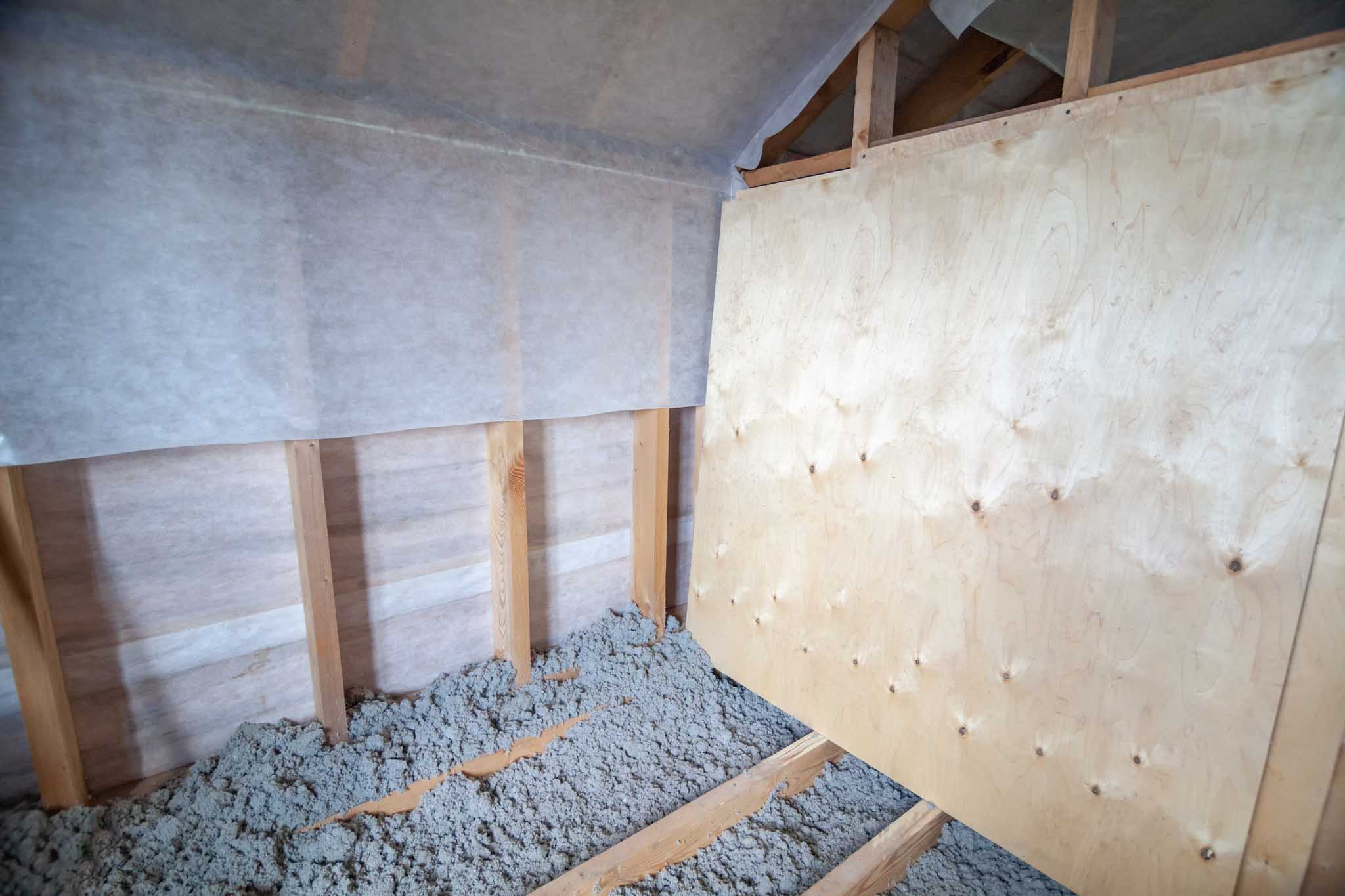An attic with a recent vapor barrier installation.